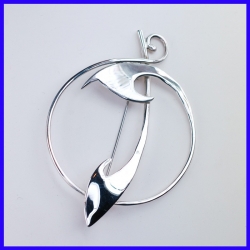 Silver brooch in circular shape. Handmade designer jewelry