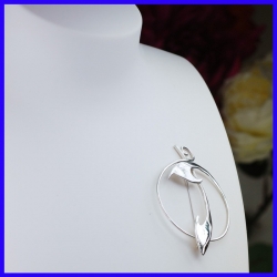 Silver brooch in circular shape. Handmade designer jewelry