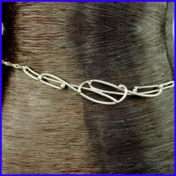 Thin silver ankle chain with motif and stone. Original jewel made by hand