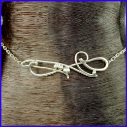 Thin silver ankle chain with pattern. Original jewel made by hand.