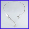 Asymmetrical torch in solid silver.