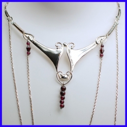 Necklace in pure silver with garnets. Handmade designer jewelry