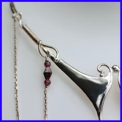 Necklace in pure silver with garnets. Handmade designer jewelry