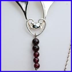 Necklace in pure silver with garnets. Handmade designer jewelry