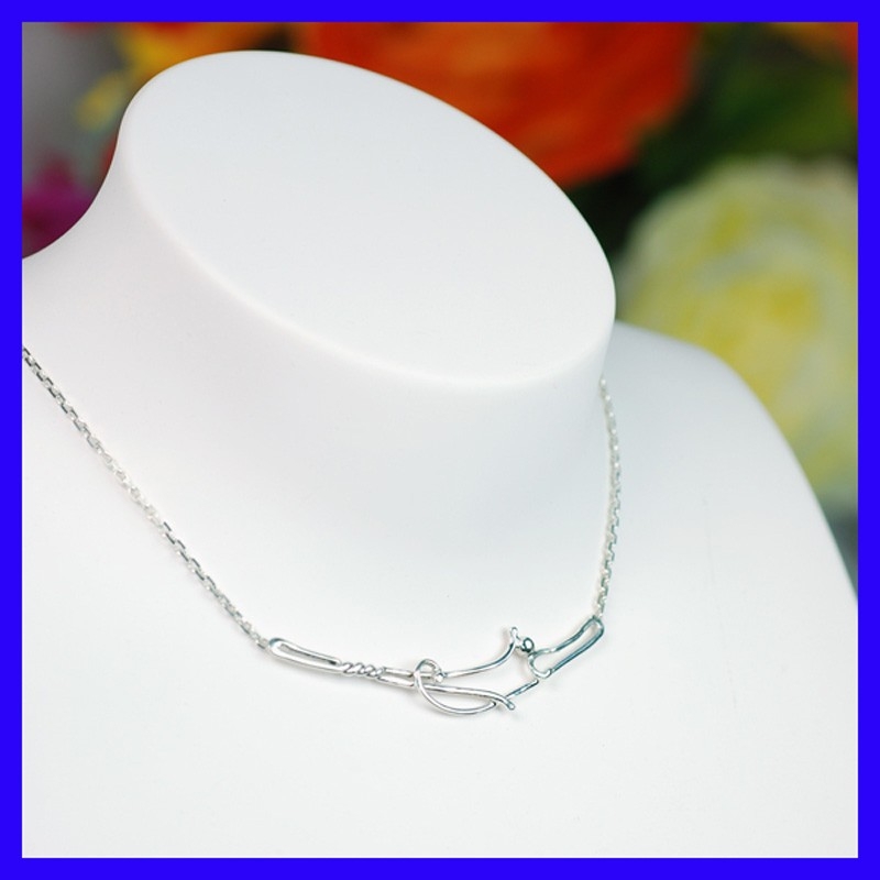 Necklace in pure silver with fine patterns. Jewel of a handmade designer.