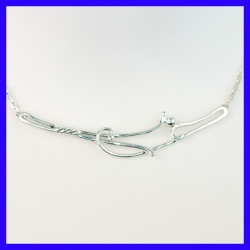 Necklace in pure silver with fine patterns. Jewel of a handmade designer.