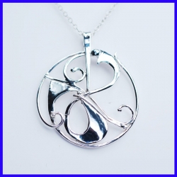 Gaelic pendant in pure silver with circular shapes. Jewel of a handmade designer.