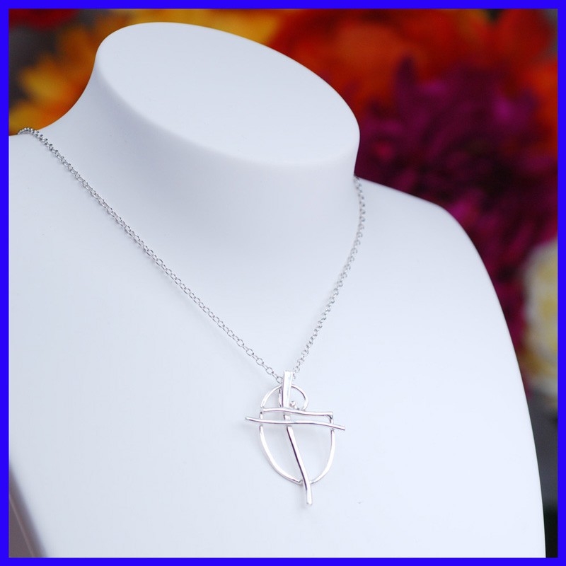 Cross in pure silver. Handmade designer jewelry