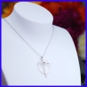 Pendant in the shape of a silver cross. Handmade jewelry by a jewellery craftsman