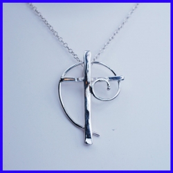 Cross in pure silver. Handmade designer jewelry