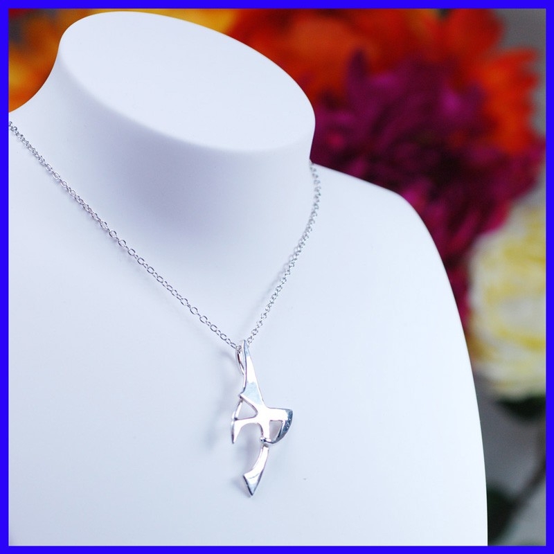 Handmade silver cross jewelry. Designer pendant in the shape of a cross with or without chain.