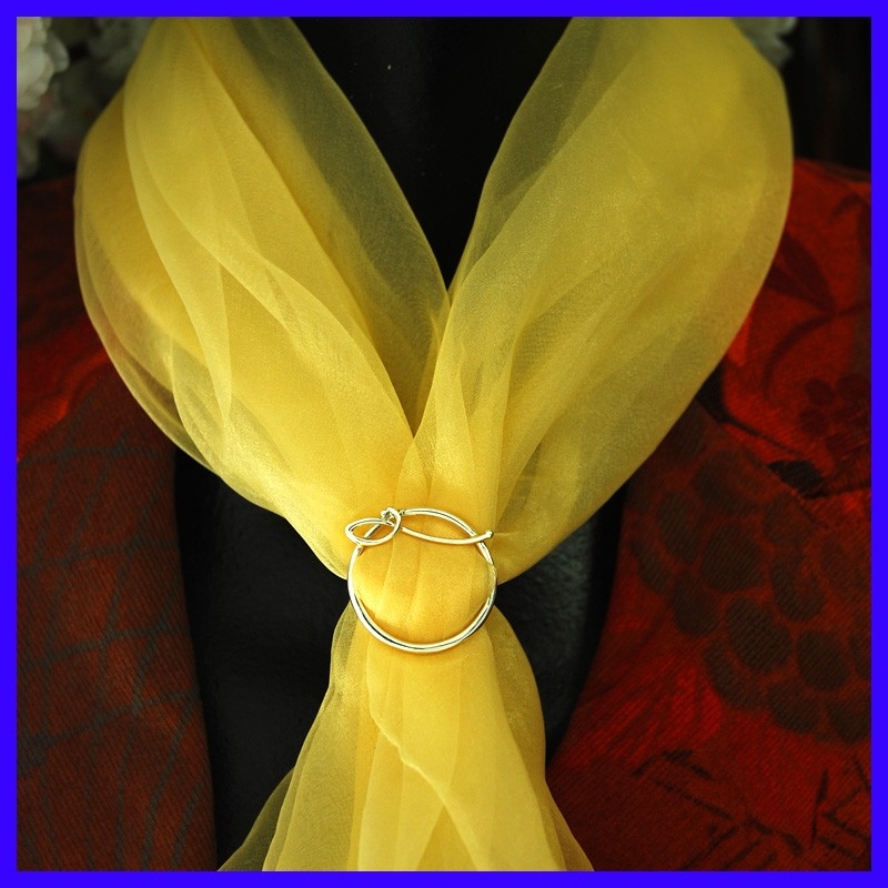 Silver scarf attachment. Silver scarf attachment.
