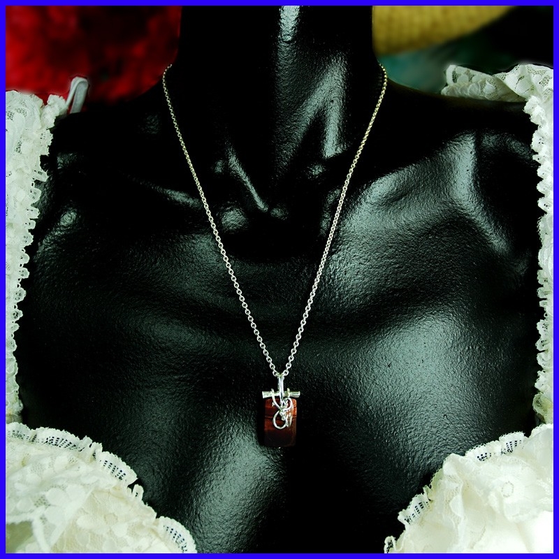 Silver tribal pendant with a bull's eye. Silver tribal pendant with a bull's eye.