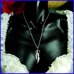 Solid silver feather pendant... Handmade designer jewelry.