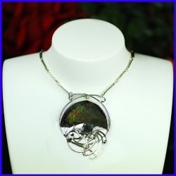 Necklace in pure silver with a rainbow pyrite. Handmade designer jewelry.