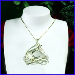 Pendant Horse in silver and gold.