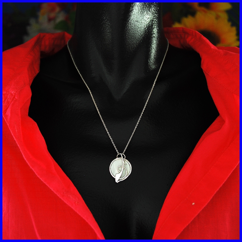 Silver and mother of pearl pendant. Designer and handmade jewel.