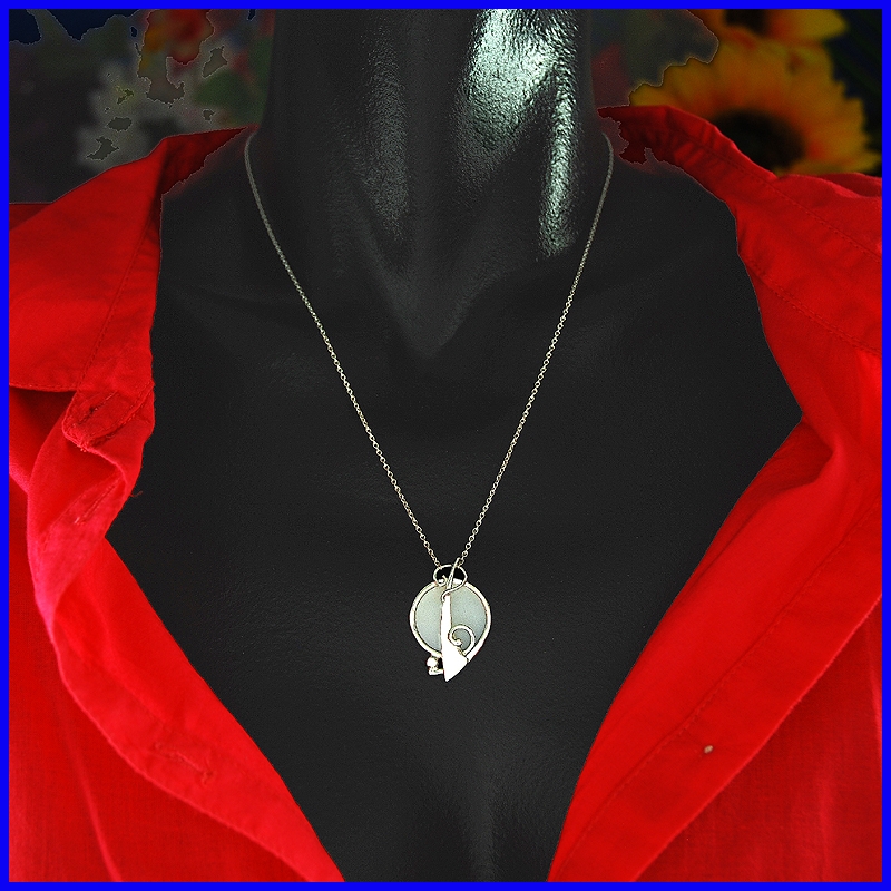 Silver and mother of pearl pendant. Designer and handmade jewel.