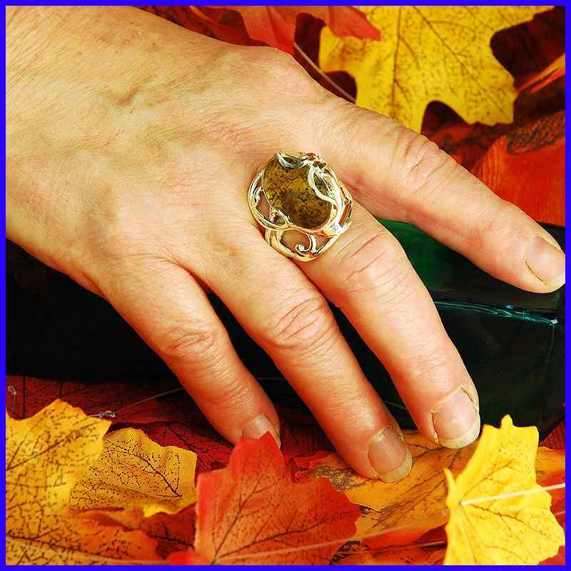 Silver ring with a yellow moss quartz