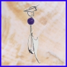 Pair of hanging silver earrings topped with amethyst. Handmade jewelry.