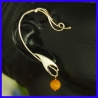 Pure silver earring with a cornelian. Handmade designer jewelry.