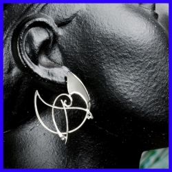 Pair of silver creole earrings. Jewelry designer for women.