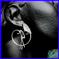 Silver creole earrings decorated with an Amethyst. Jewelry designer for women.