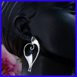 Creole silver earrings decorated with a Soladite. Jewelry designer for women.