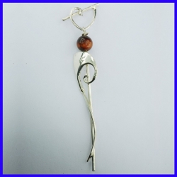 Thin hanging earrings adorned with a Tiger Eye pearl. Fashion jewellery.