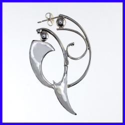 Pair of silver creole earrings. Jewelry designer for women.