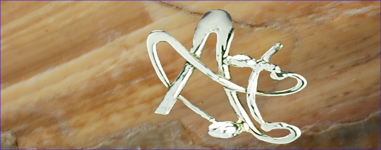 Silver alphabet and handmade pendant. Designer's jewel.